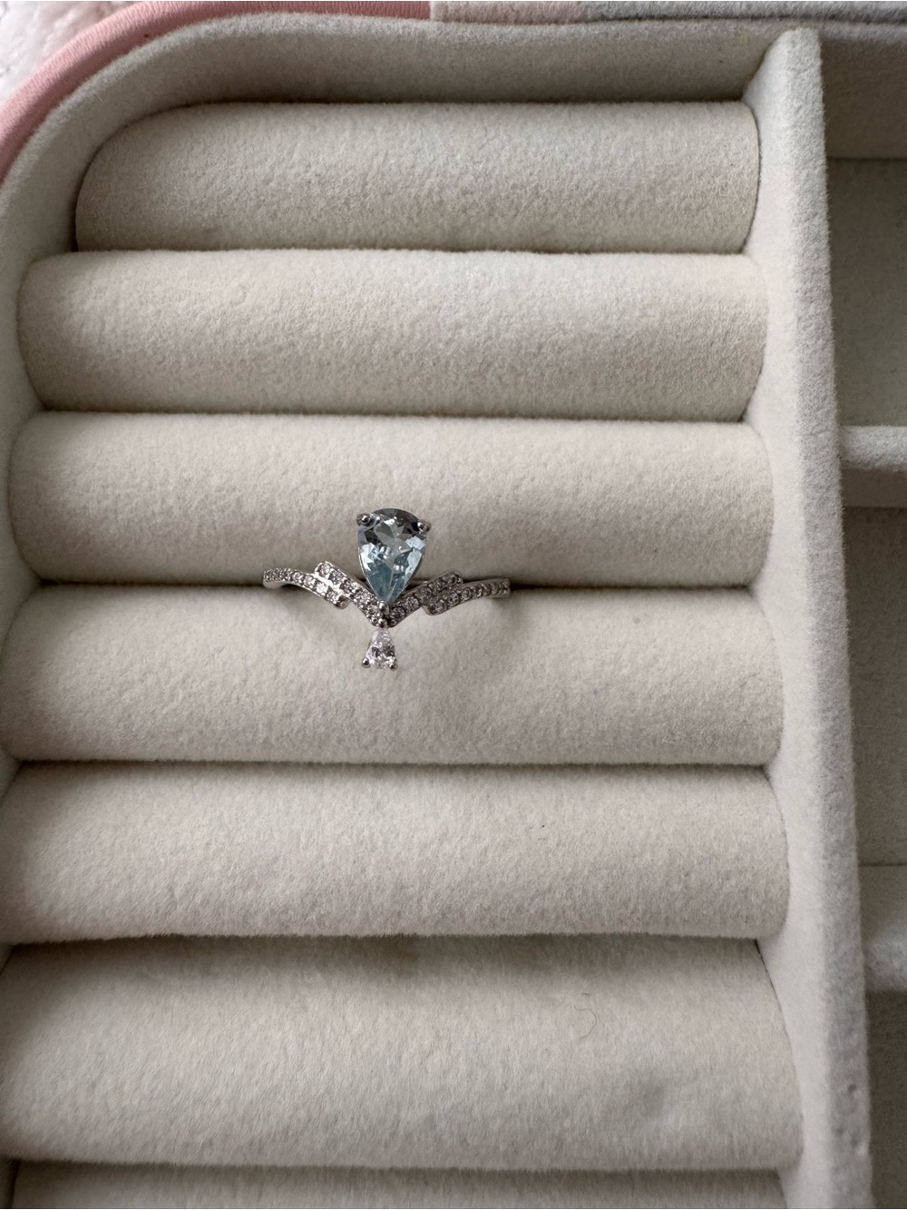 Delicate Silver Ring with Light Blue Teardrop Gem